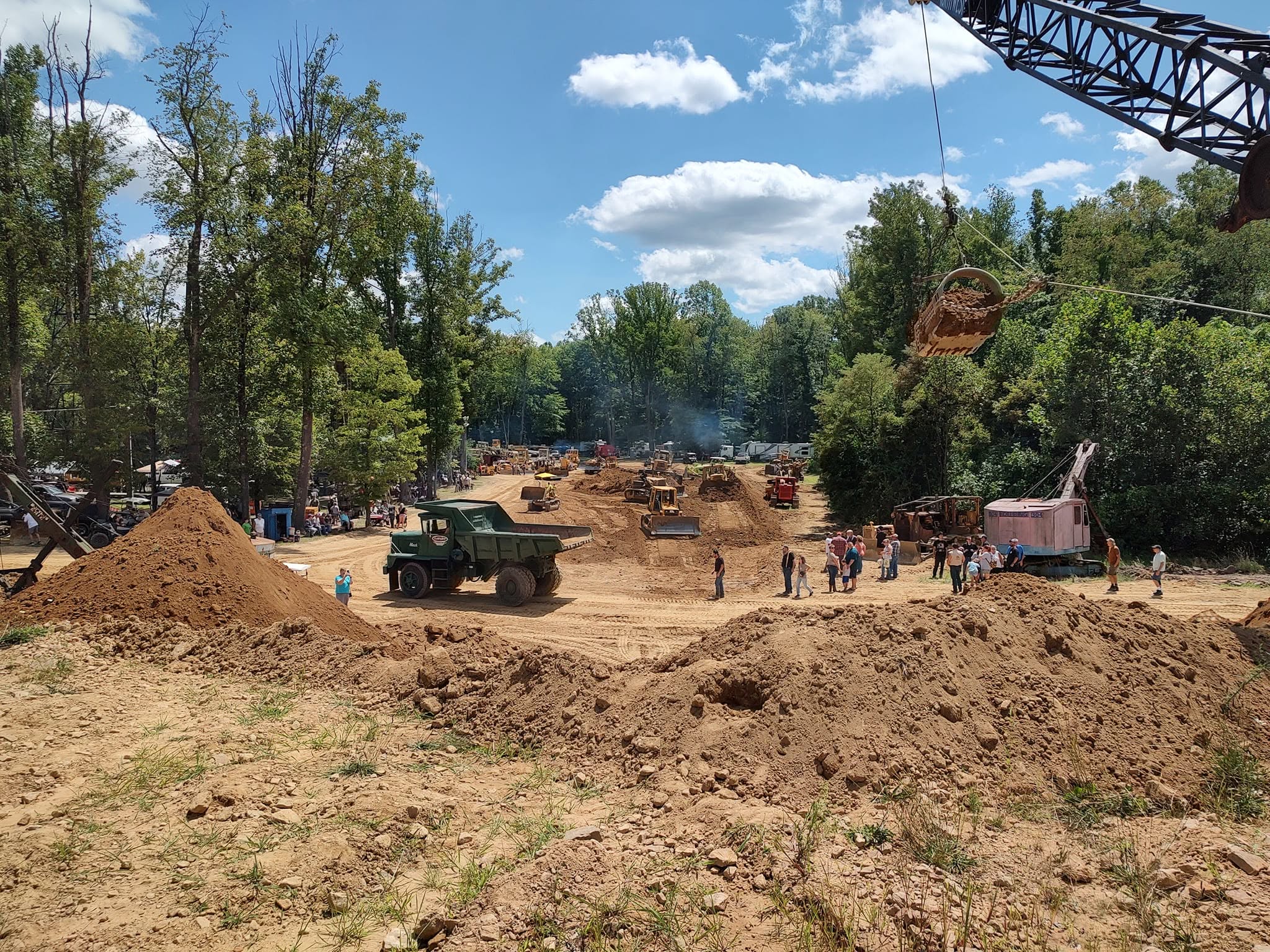 Vintage heavy equipment and cranes working the main excavation field at the Annual Steam Show
